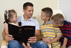 dad and children reading 